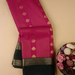 Classic Beauty in Pink with Bottle Green Combination, this Semi Kanchipuram Silk features Zari Stripes and Butta With Retta Pet Borders